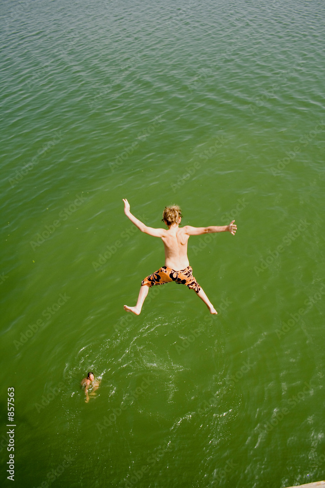 kid jumping into water
