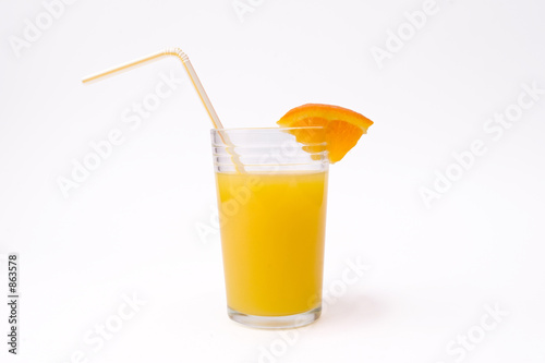 slice of orange and glass of orange juice with str