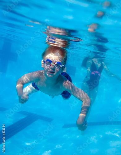 boy swimming underwater