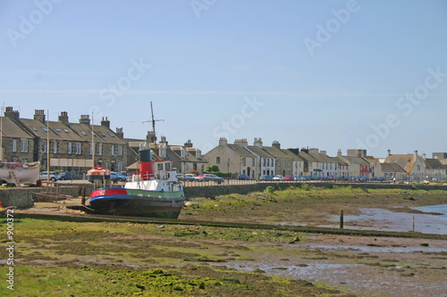 old fishing boat on sands near ayr scotland photo