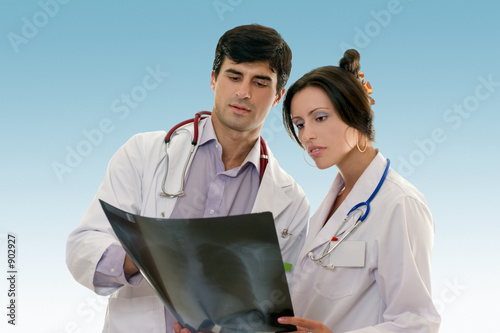 Vászonkép two doctors conferring over x-ray results