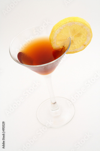 red cocktail with lemon