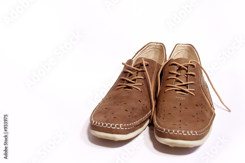 a pair of brown shoes.isolated on white