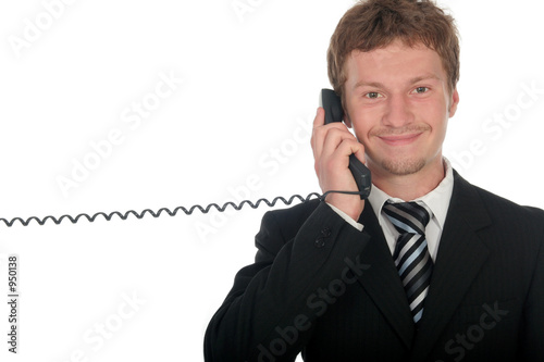 businessman holding a telephone handset