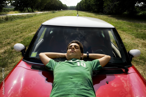 resting on a car photo