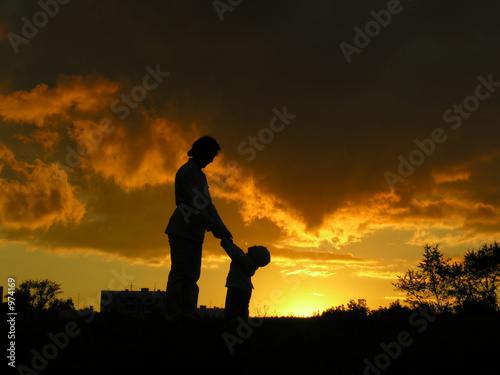 mother with baby sunset