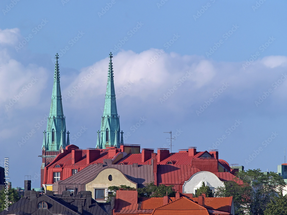 roofs and church towers at sunset