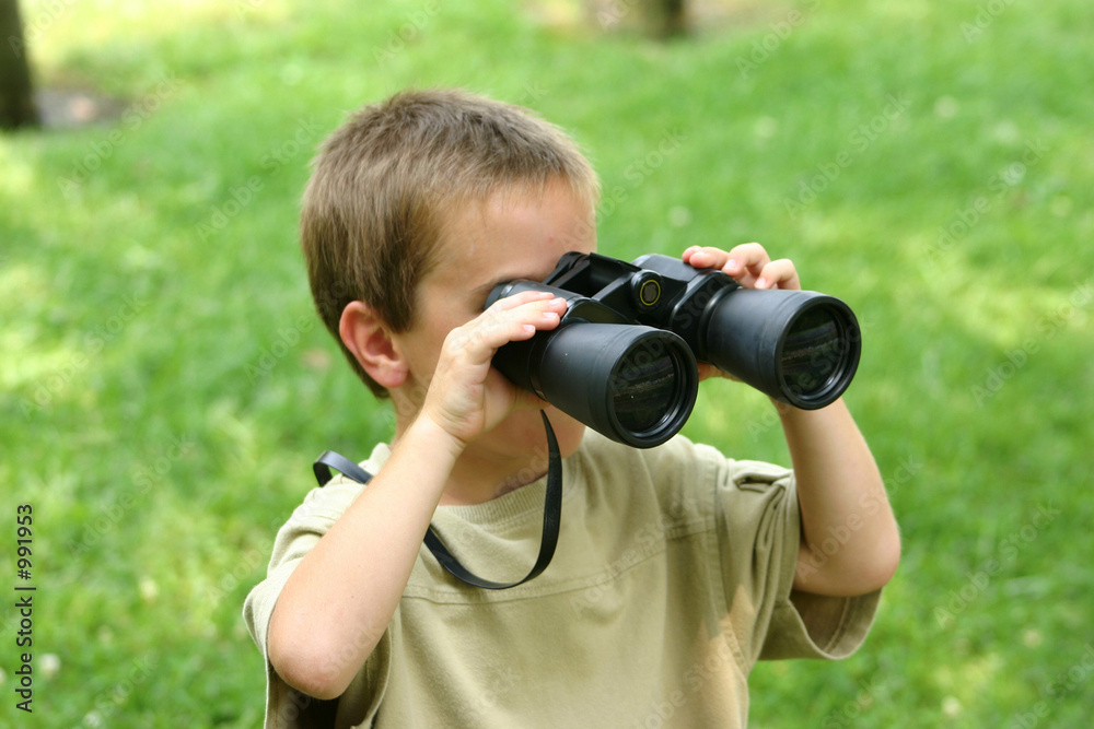 boy using binoculars