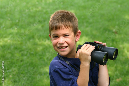 boy holding binoculars