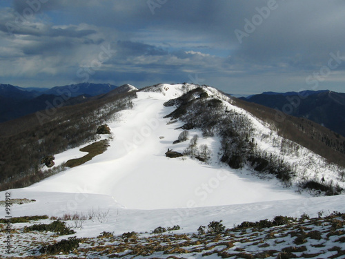 snow lake in mountains photo