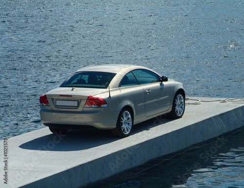 car parked on a pier photo