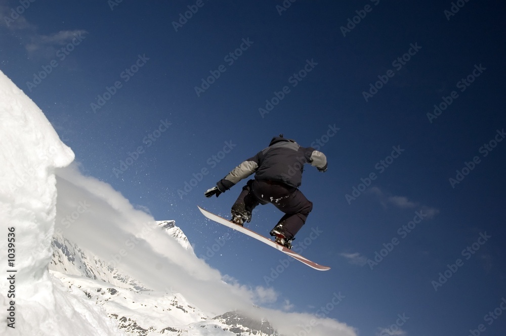 snowboarder jumping high in the air snowboarder jumping high in the air
