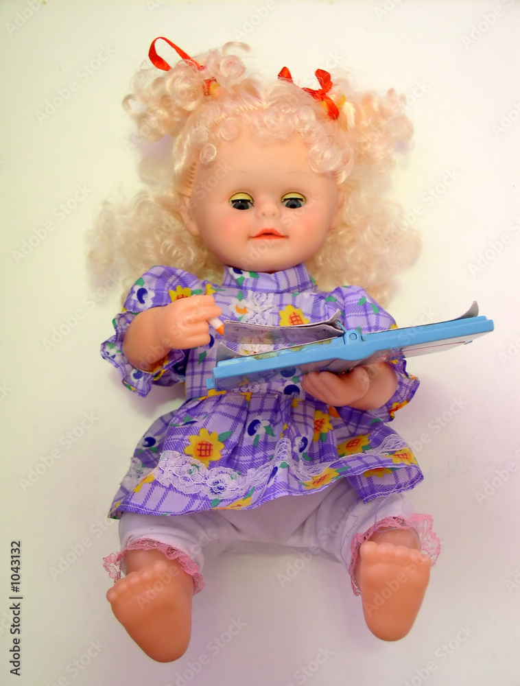 Fototapeta premium reading and writing doll