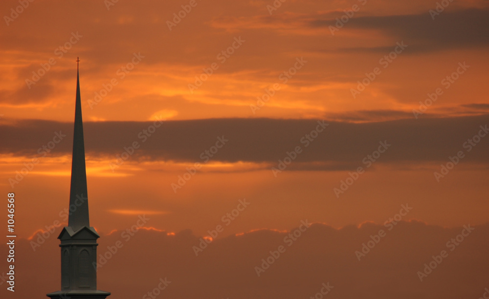 church steeple set against sunset