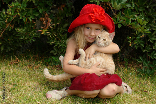 the girl in red hat with a cat