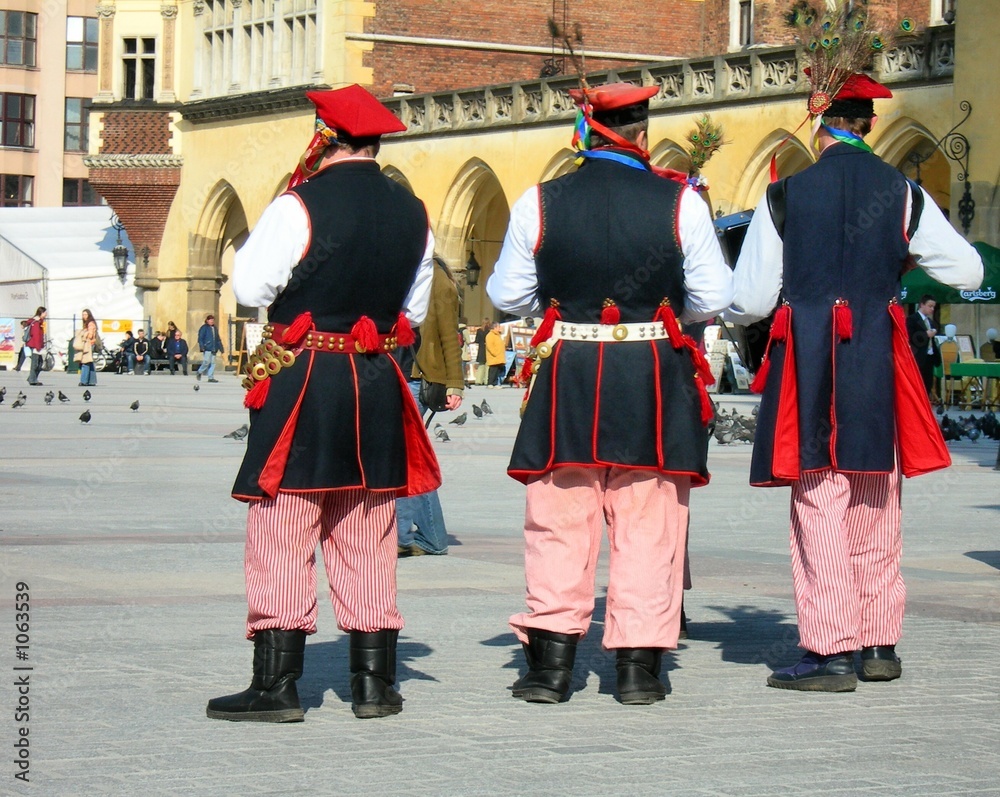 men in regional polish-cracow's suits