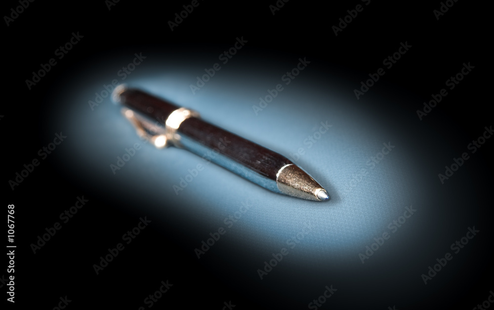 metal ballpoint pen on a dark background metal ballpoint pen on a dark background