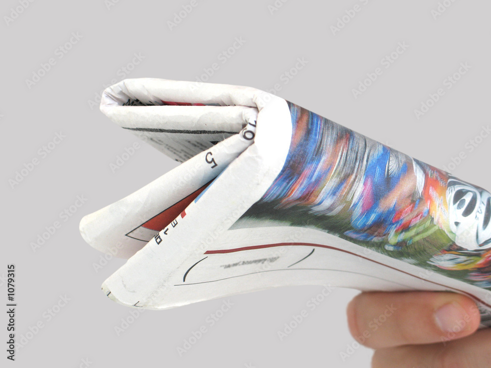 holding the newspaper