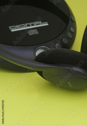 black headphones and a cd player