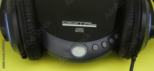 black headphones and a cd player
