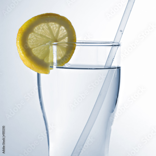 glass of water with lemon slice photo