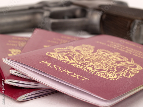 uk passports and a handgun