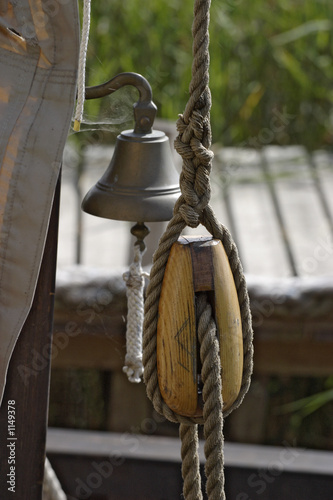 block and bell on a old sailboat.