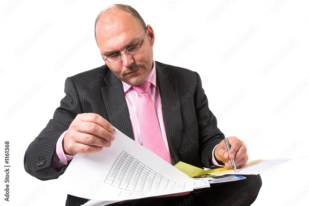 checking his spreadsheets checking his spreadsheets