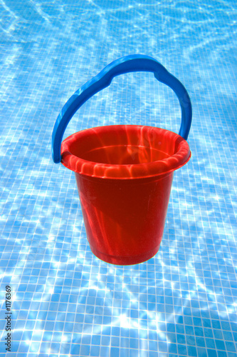 red bucket with blue handle underwater
