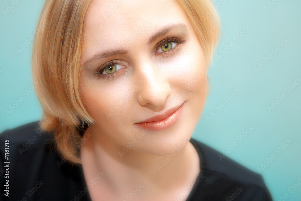 face of young blond woman with green eyes face of young blond woman with green eyes