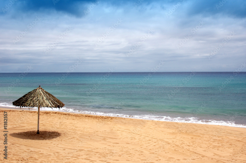 beach of sand with sun hat