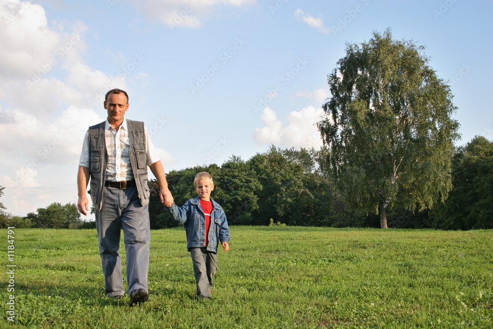 grandfather and boy walking grandfather and boy walking