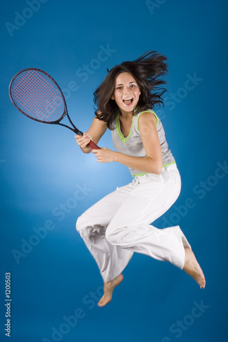 happy woman with tennis racket © Tomasz Trojanowski
