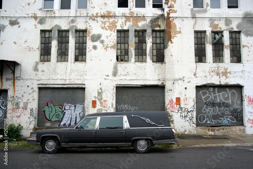 hearse and old warehouse