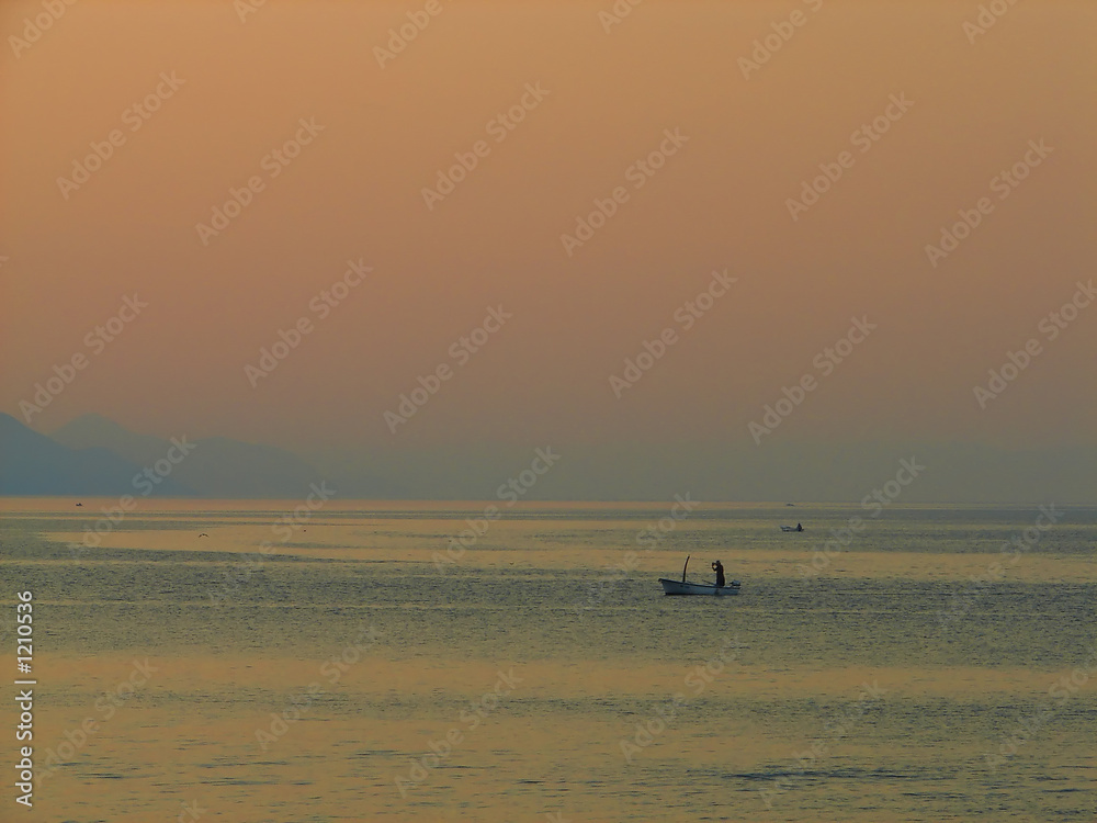 fisherman at dusk