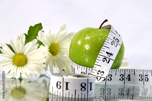 apple, flowers and measurement tape