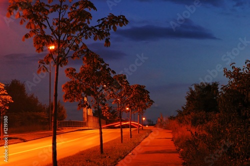 road at twilight with rearlights photo
