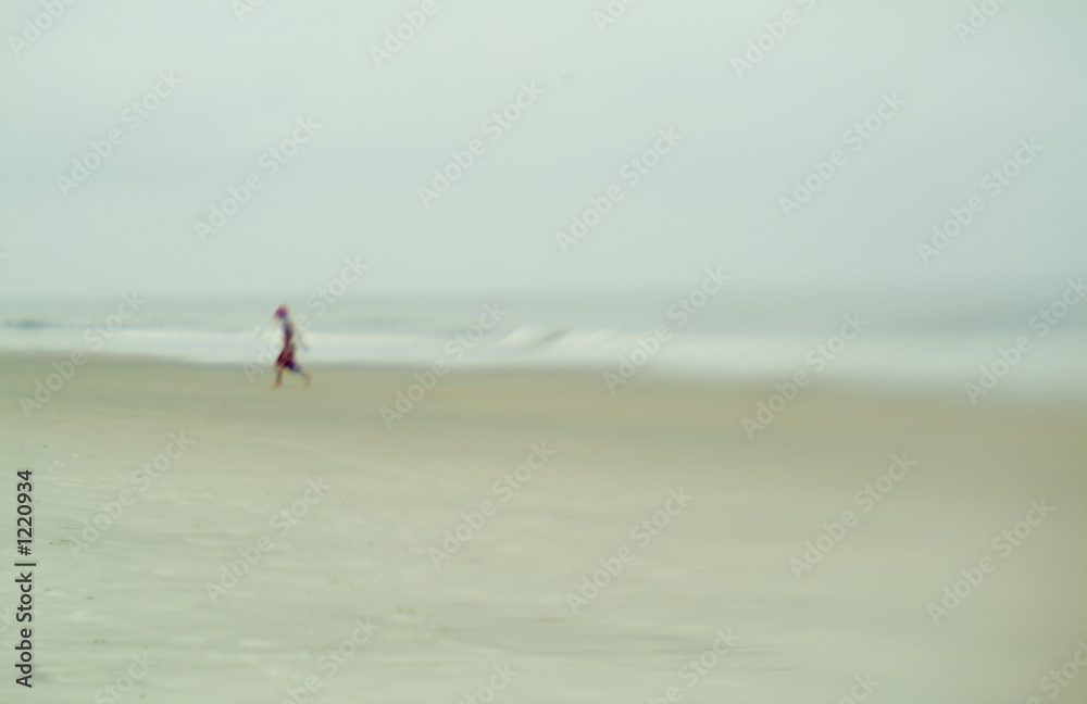foggy beach with young boy
