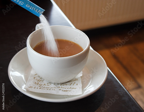 sugar flowing into a cup