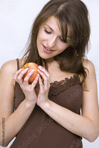 girl posing with red apple