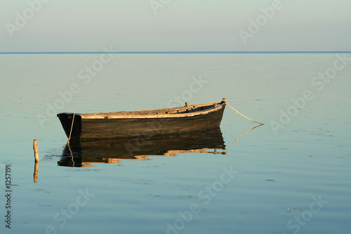 lonely boat in the quiet sea