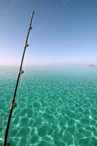 fishing rod over blue lagoon