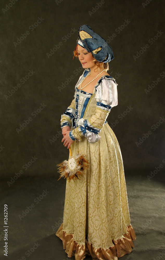 Fototapeta premium girl in polish clothes of 16 century with mirror-fan