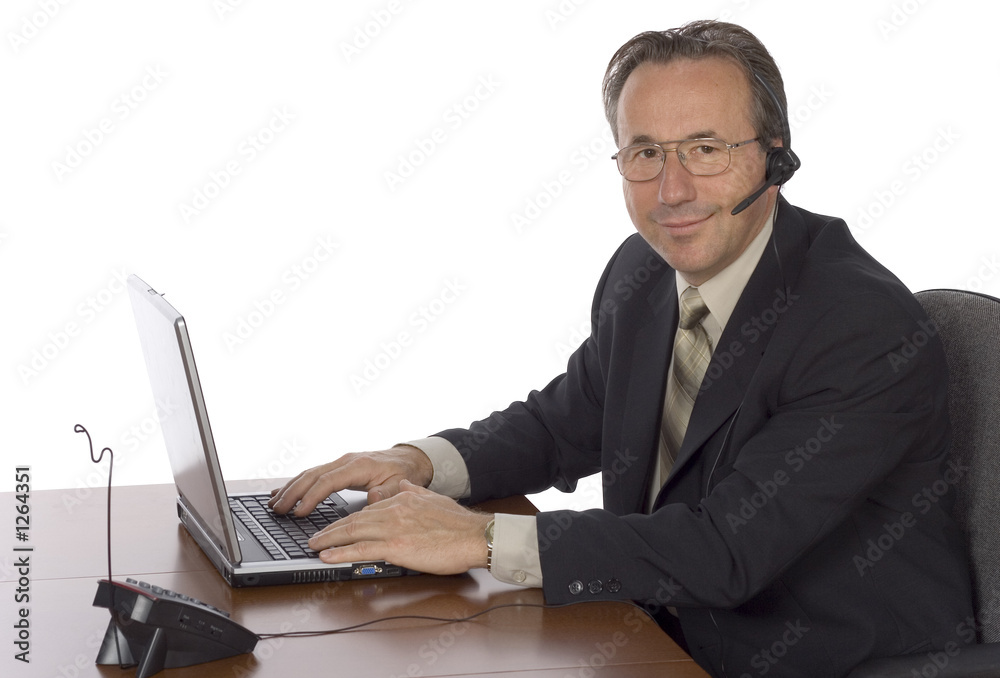 businessman at the desk with headset