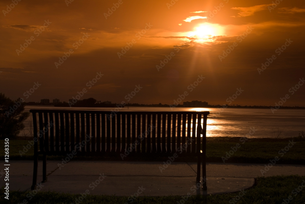 bench by the sea at sunset