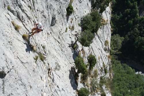 tanned woman abseiling