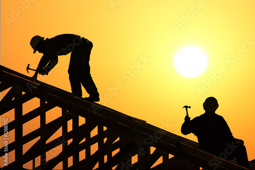 two roofer silhouette photo