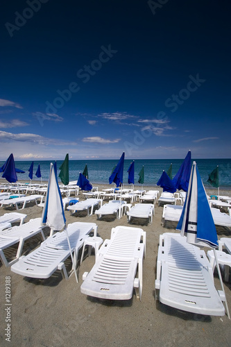 summer seaview with deck-chairs and umbrellas