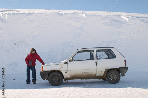 girl posing near a car