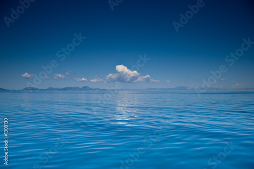 view of an open sea with a cloud on corfu island